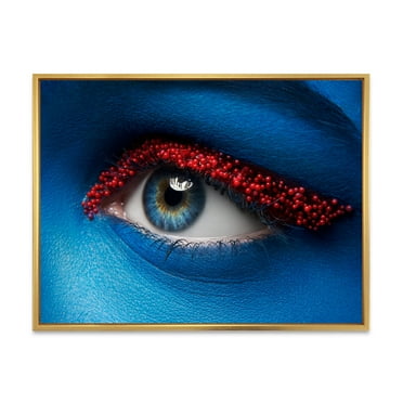 Designart 'Woman Eye With Blue Paint On Face & Red Balls' Modern Framed Canvas Wall Art Print