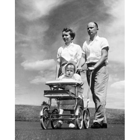 Parents pushing their daughter in a baby stroller Stretched Canvas -  (24 x