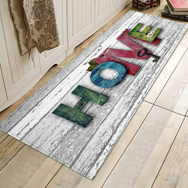 3D Printed Flannel Bath Mat Runners Non Slip Bathroom Rugs Soft and Washable Long Floor Mats for Living Room Bedroom Kitchen. The mat features a colourful 'HOME' design printed on a whitewashed wood pattern background. Made of flannel with a 10mm sponge middle layer and a non-slip plastic dot backing. Available in multiple sizes, including 40 x 60cm, 50 x 80cm, 40 x 120cm, and 60 x 180cm. Suitable for use in bathrooms, kitchens, bedrooms, and living rooms.