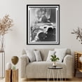 thumbnail image 4 of Historic Framed Print, [Couple kissing at drive-in theater in Rome, Italy where Gary Cooper and Audrey Hepburn are likewise engaged on screen], 17-7/8" x 21-7/8", 4 of 9