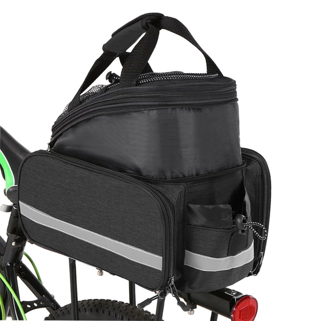 Bicycle Rear Seat Bag Multifunction Expandable Waterproof MTB Bicycle Pannier Bag Bike Rack Bag With Rain Cover. The bag is shown mounted on a bike rack, featuring a black waterproof fabric with reflective strips on the sides for visibility. It includes expandable side pockets, a main compartment with a zipper, and a mesh pocket with an elastic strap. The bag also has a handle and shoulder strap for portability. A rain cover is included for added protection.