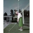 thumbnail image 1 of Ginger Rogers 1940's takes a practice golf swing in Beverly Hills 24x30 poster, 1 of 1