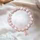 thumbnail image 4 of Pulsera de Lazo Rosa para La Concienciación Sobre El Cáncer de Mama | Joyería Solidaria con Cuentas de Vidrio Tejidas y Diseño de Corazón | Símbolo de Apoyo y Esperanza, 4 of 6