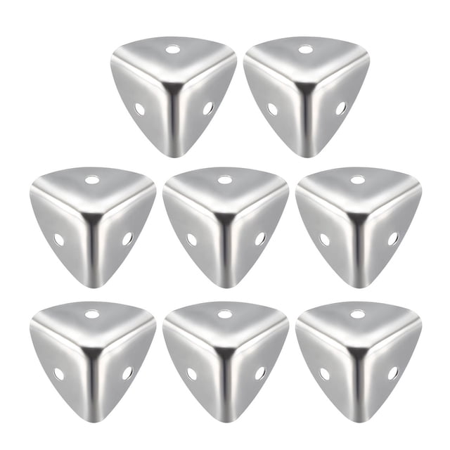 Unique Bargains Metal Box Corner Protectors Edge Guard Protector, 25 x 25 x 25mm, in a silver tone finish. Made of polished stainless steel, these lightweight and durable corner protectors feature rounded edges and pre-drilled holes for easy installation. Suitable for protecting wooden objects like tables, toolboxes, decorative gift boxes, and other square corners. Package includes 8 pieces.