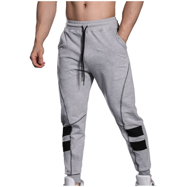 Pantalones largos de moda para hombre, casuales, de color sólido, con cintura elástica y bolsillos, con pernera ajustada, pantalones largos de poliéster y algodón para hombre.