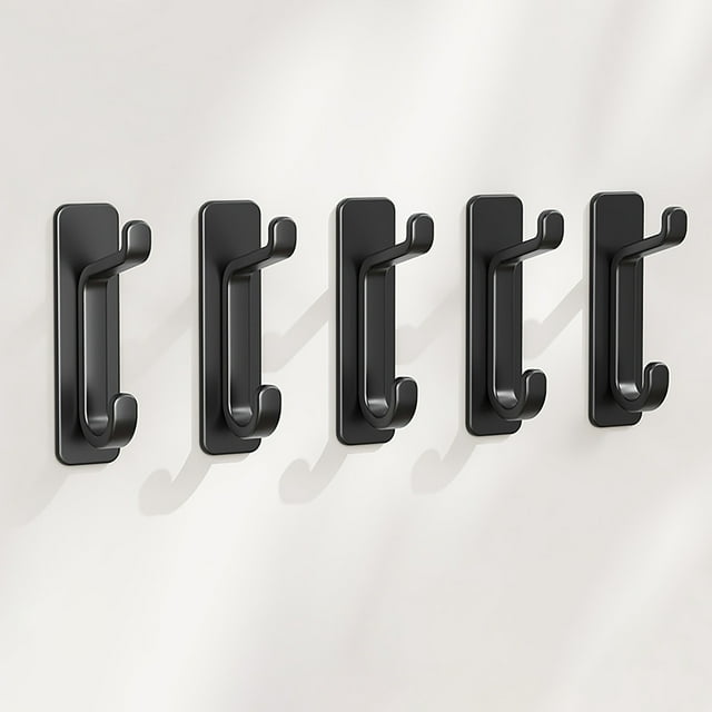 Hooks for Bathroom and Kitchen Heavy Duty Towel Hooks Wallet Racks Door Walls for Dormitory and Home Organization 5PCS. A set of five black heavy-duty hooks with a sleek, modern design, mounted on a smooth wall surface. These versatile hooks are ideal for organizing towels, wallets, and small accessories in bathrooms, kitchens, dormitories, or other spaces. Compact and easy to install without drilling, they are designed for durability and strong load-bearing performance.