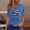 Blue, variant on 250th Anniversary Shirts for Women 2026 - Patriotic "We the People" V-Neck Button Short Sleeve Tee - Vintage Distressed USA Flag Graphic Top Army Green M