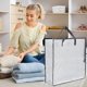 thumbnail image 1 of Bolsa de almacenamiento grande con asas, de tela impermeable blanca con cierre negro transparente, ideal para guardar ropa y lino, o para coronas navideñas., 1 of 5
