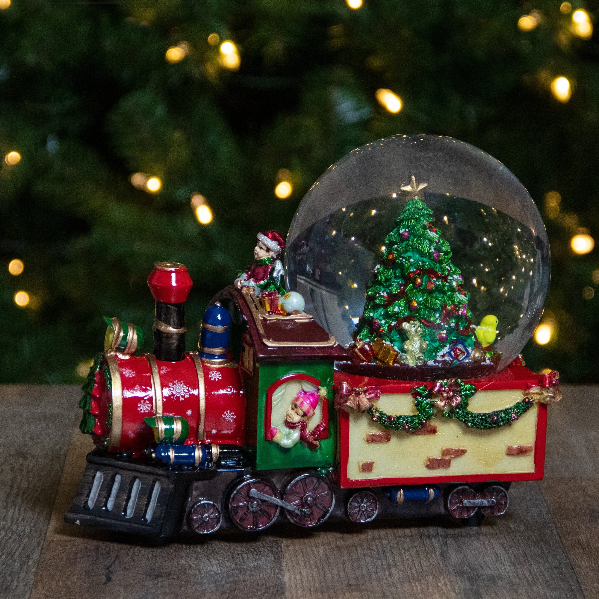 musical christmas train under tree