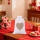 thumbnail image 1 of Bolsa de regalo con cordón en forma de corazón | Envoltorio para dulces de boda (1 unidad) | 10 x 14 cm, beige, blanco, rojo y caqui | Poliéster resistente, 1 of 6