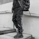 thumbnail image 2 of Pantalones de hombre multibolsillos negros de otoño para hombre, pantalones cargo multibolsillos estilo hip hop, pantalones holgados estilo emo, ropa técnica de gran tamaño de licra, 2 of 5