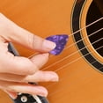 thumbnail image 3 of GOOHOCHY Juego de púas de guitarra de 50 piezas, púa de plástico, púas de guitarra para pulgar, púa de dedo índice, 3 of 7