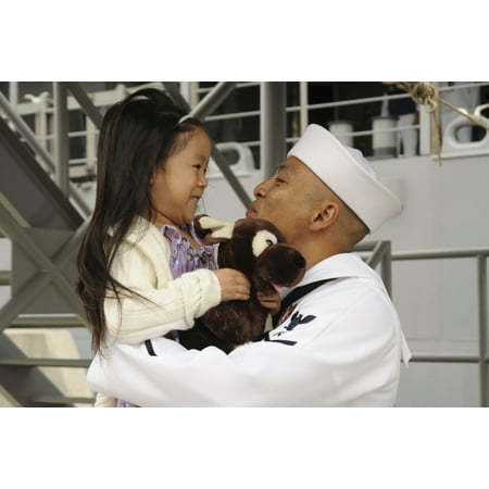 San Diego California May 23 2012 - US Navy sailor receives a hug from his daughter during a homecoming celebration at Naval Base San Diego California Poster