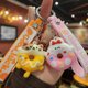 thumbnail image 4 of Llavero creativo con forma de donut de PVC de goma suave con forma de dinosaurio para coche, colgante de bolso para niños kawaii, accesorios de cumpleaños, 4 of 5