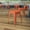 Orange, variant on Emma + Oliver 18 Inch Table Height Indoor Stackable Metal Dining Stool in Red-Set of 4