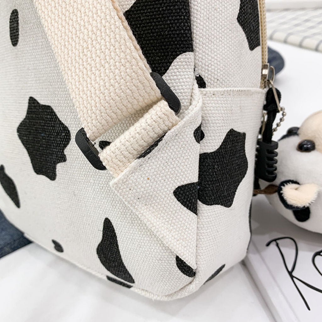 Cow print sling tote bag with removable strap
