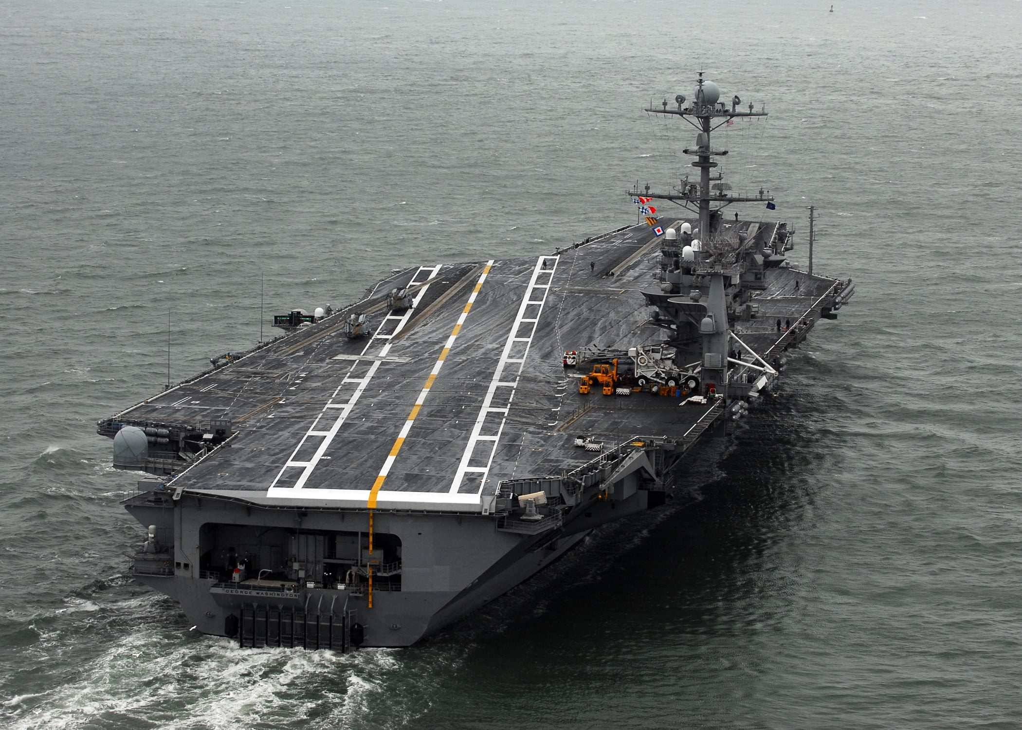 The Nimitzclass aircraft carrier USS Washington (CVN 73) steams through the Chesapeake
