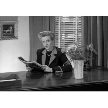 - Woman reading magazine Poster Print
