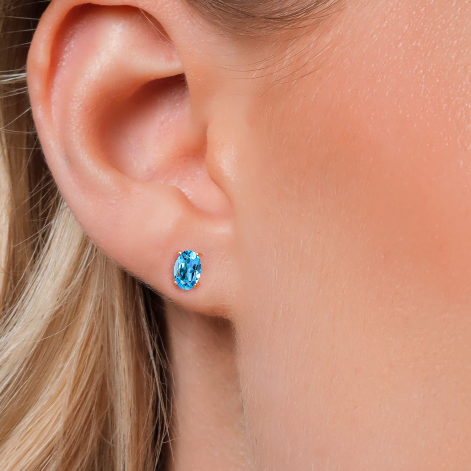 Gem Stone King 10K Yellow Gold Swiss Blue Topaz Stud Earrings for Women Men (1.10 Cttw, Gemstone November Birthstone, Oval 6X4MM)