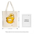 thumbnail image 3 of Stylish Canvas Tote Bag featuring a unique abstract face design in vibrant yellow and white perfect for shopping travel and parties, 3 of 4