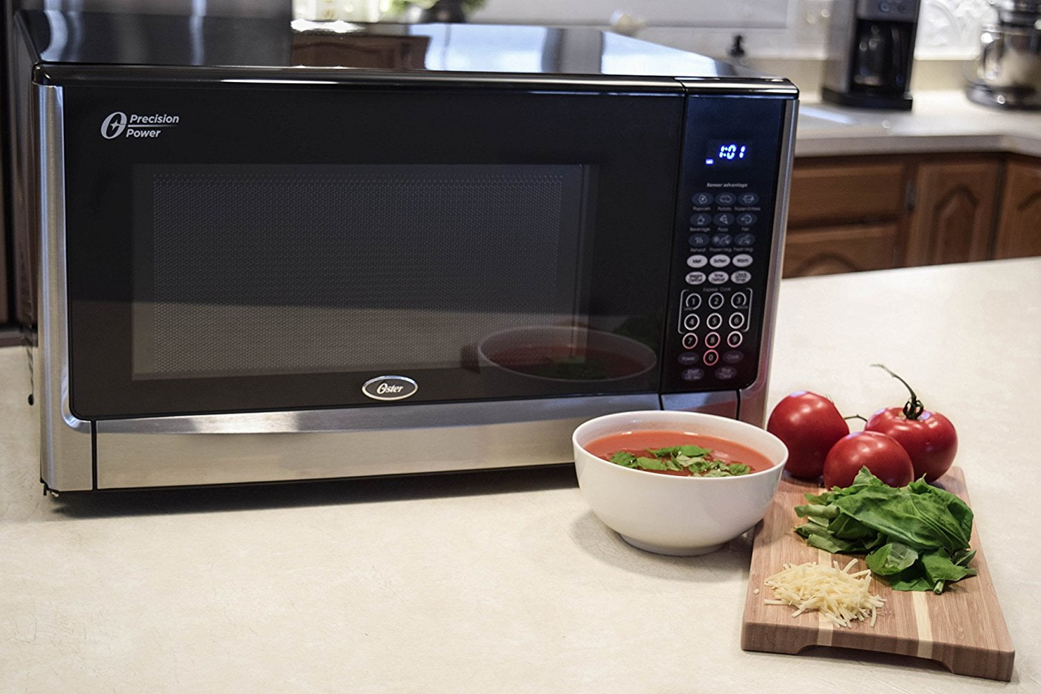 Oster OGYZ1604VS 1.6 Cubic Foot 1100 Watt Microwave Oven with Inverter and Senso