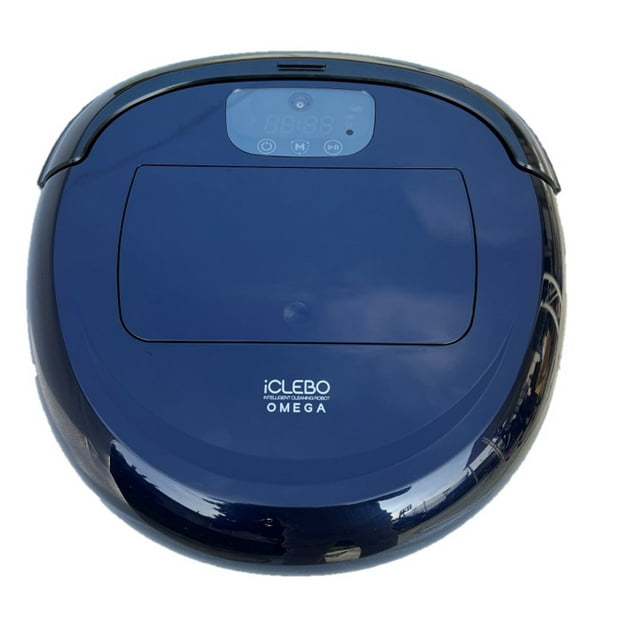 iCLEBO Omega Camera Gyroscope Navigating Robot Vacuum Cleaner and Mop YCR-M07-20 in a sleek dark blue finish. The top view highlights its compact, rounded design with a digital display panel and the iCLEBO Omega branding. Equipped with a camera mapping system, 19 obstacle detection sensors, and turbo suction for efficient cleaning on various surfaces like hardwood, marble, and linoleum. Features include deep corner side brushes, anti-tangling rubber blades, and a bagless dust bin for easy maintenance.