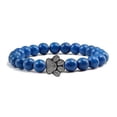 thumbnail image 1 of Pulsera con dije de huella de pata de piedra volcánica de lava negra mate natural, ideal como recuerdo para mascotas, amantes de los gatos y los perros., 1 of 2