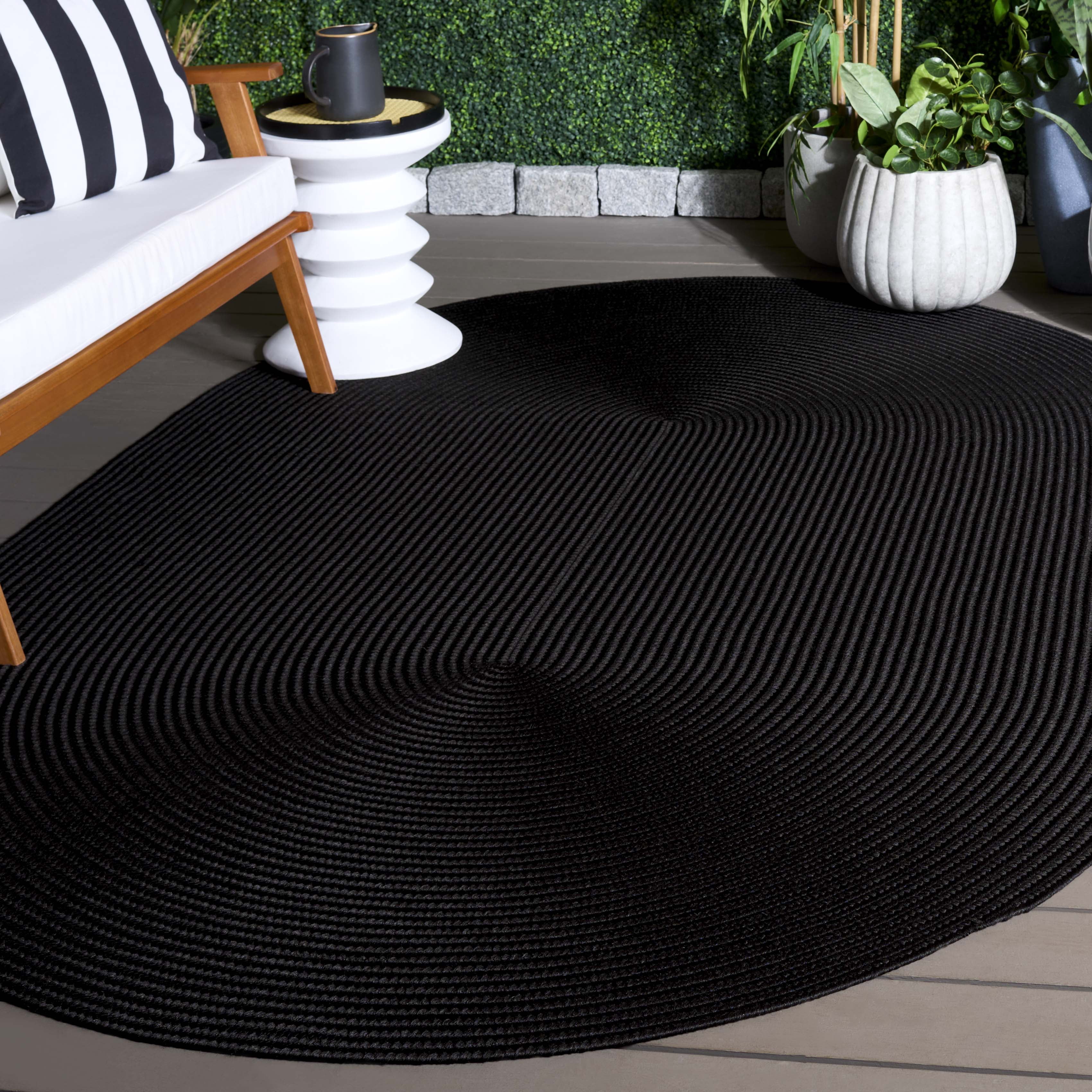 SAFAVIEH Braided Rishika Solid Machine Washable Reversible Area Rug, Black, 5' x 8' Oval