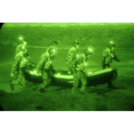 Us Sailors Assigned To Basic Underwater DemolitionSeal Training Class Carry An Inflatable Boat Toward The Surf In San Diego California Feb 25 2010