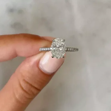 2.99 TCW Oval Cut Moissanite Hidden Halo Engagement Ring 14K White Gold Plated