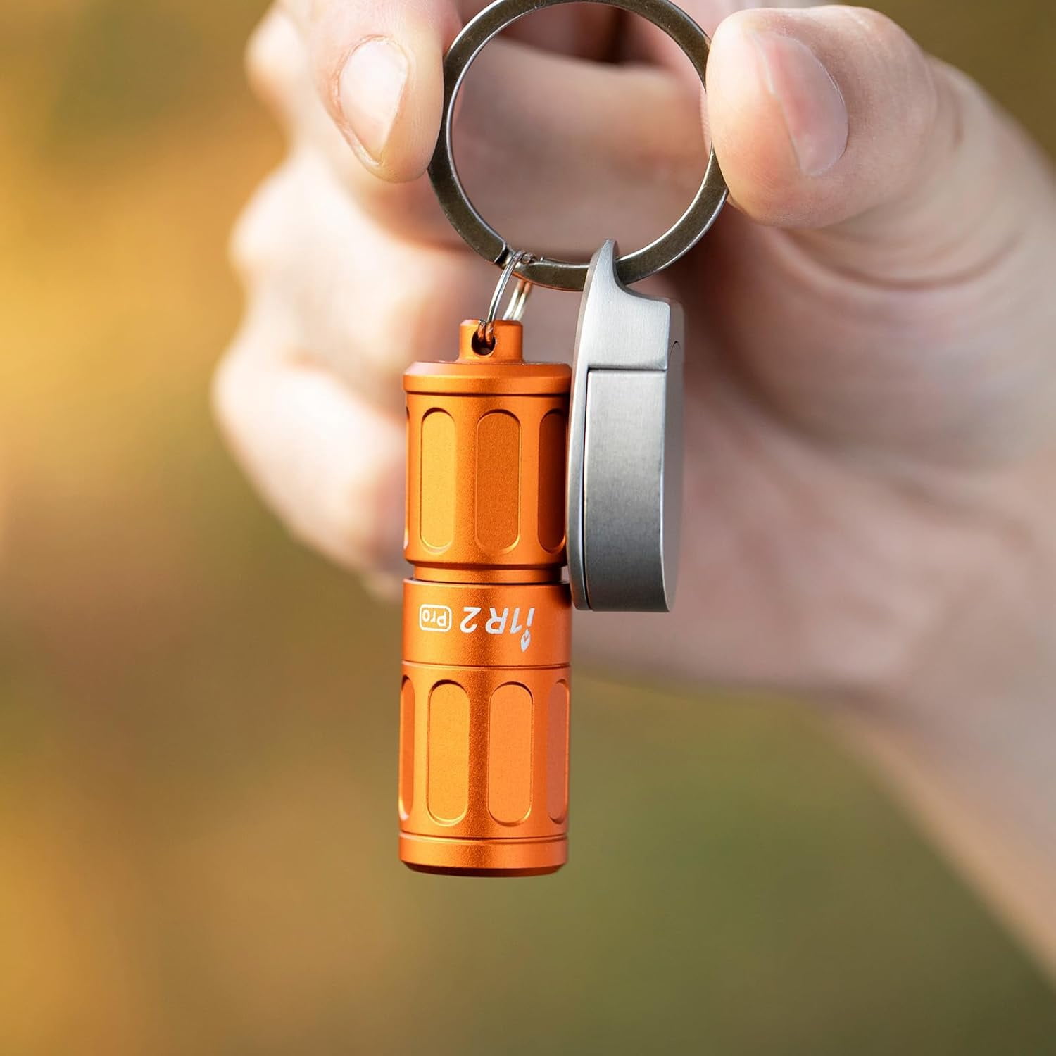OLIGHT I1R 2 Pro Eos 180 Lumens EDC Rechargeable Keychain Flashlight. (Capsule Orange)