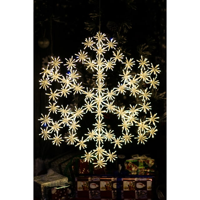 32 In Cluster Snowflake Christmas Light featuring 804 warm white sparkling LEDs, including 67 flashing bulbs for a glimmering effect. Designed with a transparent wire and white frame, this snowflake is ideal for holiday lighting and suitable for indoor and outdoor decor. Powered by a ULIP44 30v 12w transformer.