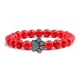 thumbnail image 1 of Pulsera con dije de huella de pata de piedra volcánica de lava negra mate natural, ideal como recuerdo para mascotas, amantes de los gatos y los perros., 1 of 2