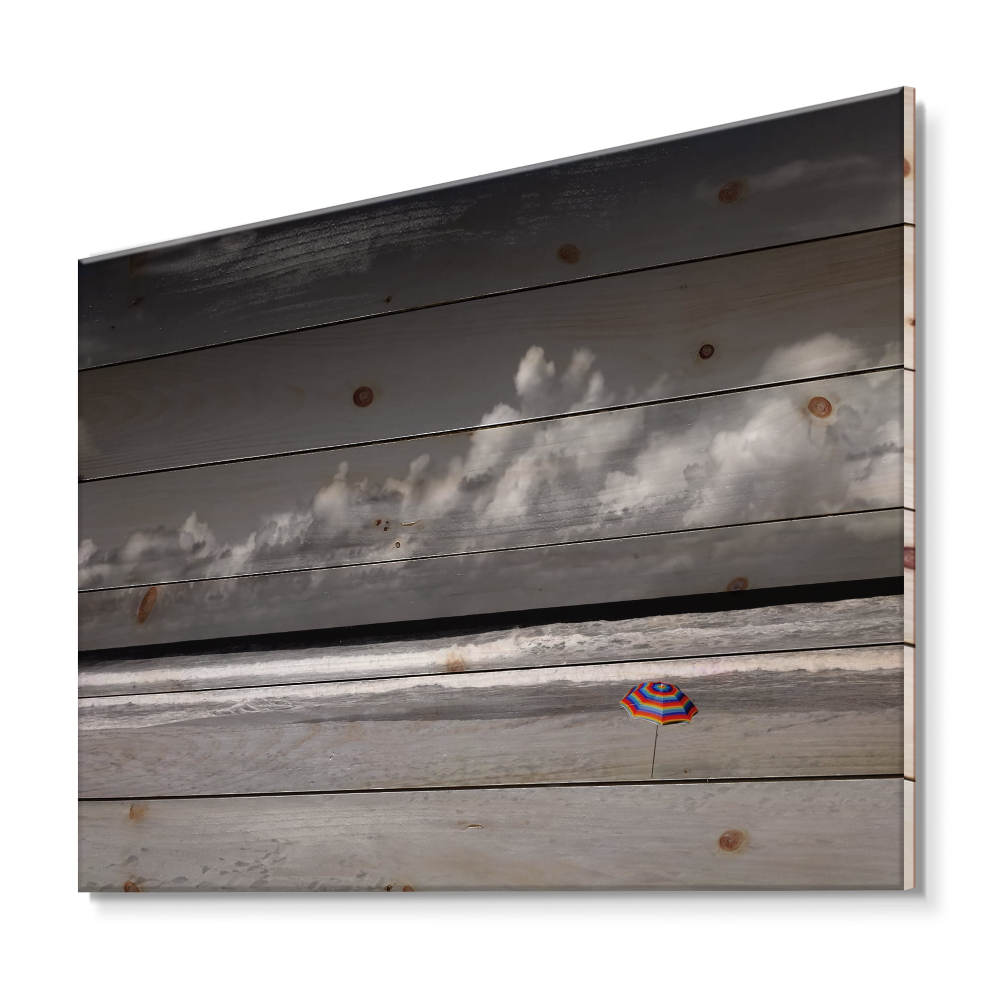 Designart 'Black and White Coastline Under Cloudy Sky' Lake House Print on Natural Pine Wood