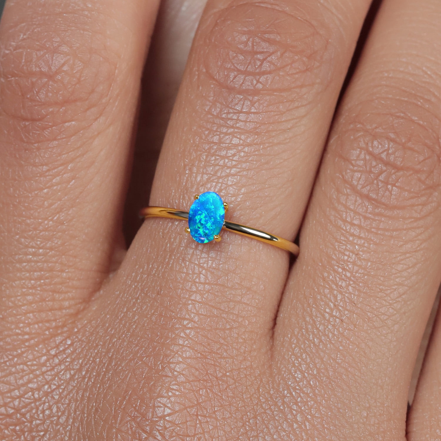 Gem Stone King 10K Yellow Gold Blue Simulated Opal Women Engagement Ring (0.50 Ct Oval Cabochon Cut 6X4MM,)