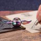 thumbnail image 4 of Fidget Spinner de esfera de metal sólido, juguete giratorio iridiscente sensorial para manos y dedos, alivio del estrés, TDAH, ansiedad y reductor para niños y adultos., 4 of 5