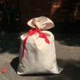 thumbnail image 1 of Venta al por mayor de bolsas de regalos de Navidad, bolsa de Papá Noel con sublimación en blanco de lona 100% poliéster con cordón rojo para Navidad, 1 of 4
