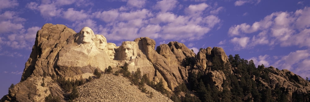 Panoramic image with white puffy clouds behind Presidents George Washington Thomas Jefferson Teddy Roosevelt and Abraham Lincoln at Mount Rushmore National Memorial South Dakota Canvas Art - Panoramic