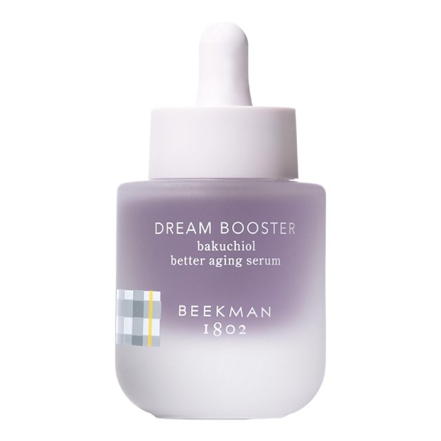 sérum facial beekman 1802 dream booster bakuchiol 30 ml vegano frasco centrado, vista frontal con cuentagotas blanco; botella de vidrio esmerilado en degradado lavanda con texto impreso "DREAM BOOSTER bakuchiol better aging serum" y logo Beekman 1802 visible; aplicar 1–2 gotas en la rutina nocturna; a menudo usado como suero ligero antes de la crema hidratante.