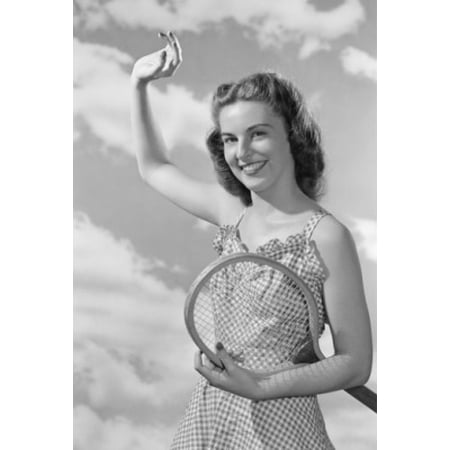Portrait of female tennis player smiling Poster