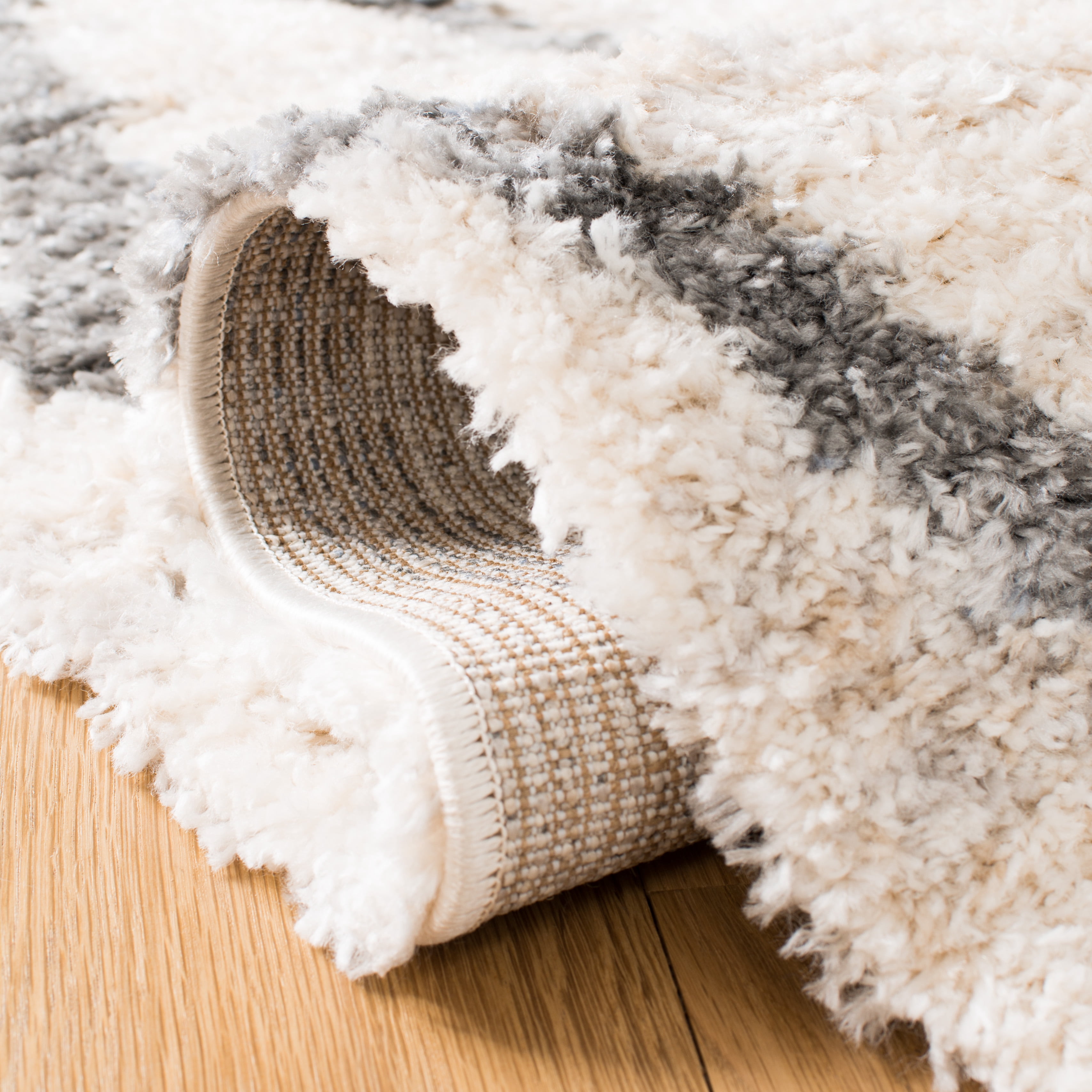 SAFAVIEH Berber Fringe Amyas Geometric Shag Runner Rug, Creme/Black, 2' x 8'
