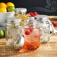 thumbnail image 2 of Mason Drinking Jars – Set of 4, 15.25 Oz Clear Glass Jar with Handle and Lid. – Ice-Cold Drink Glassware Logo – Glass Mugs Ideal for Cold Beverages, Juice, Smoothie, Cocktails., 2 of 9