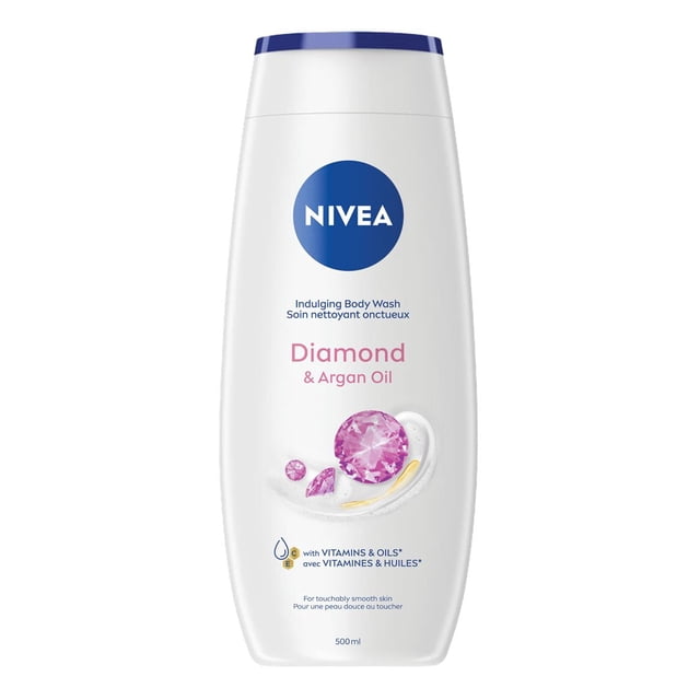 NIVEA Diamond & Argan Oil Indulging Body Wash for Women with Diamond Powder in a 500 ml white plastic bottle with blue cap, featuring pink diamond graphics and text highlighting vitamins and oils for moisturizing and smooth skin.