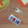 thumbnail image 2 of Grinning Nutcracker Soldier with Snowflakes Rectangle Chrome Plated Metal Keychain Key Chain, 2 of 3