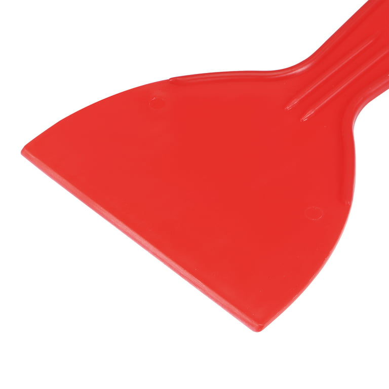 red plastic putty scraper