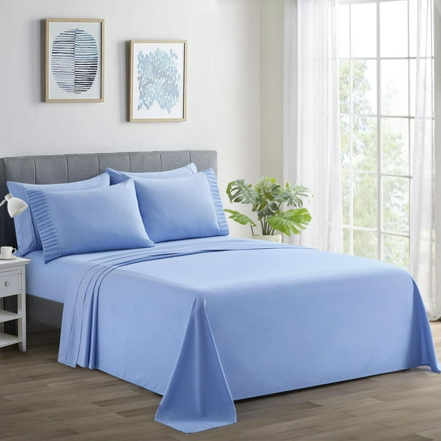 Blue Marina Decoration ultra soft silky deep pocket rayon from bamboo sheet set with pillowcases displayed on a made bed in a sunlit room.