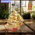 thumbnail image 4 of Rotating acrylic display featuring a golden large ancient sailing ship on a clean white background with a minimalist Muji design, 4 of 6