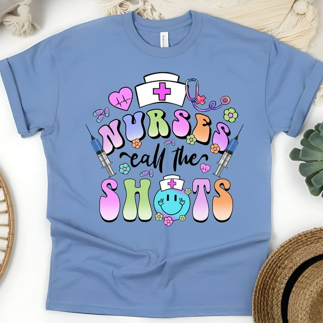 Nurses Call The Shots T-Shirt | Funny Nurse Graphic Tee with Syringe Design, CarolinaBlue, Size L
