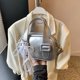 thumbnail image 1 of Bolso de piel suave estilo occidental para mujer, nuevo bolso de mano coreano texturizado para mujer, bolso bandolera informal y versátil con forma de almohada, 2025, 1 of 5