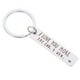 thumbnail image 1 of Llavero de acero inoxidable con texto "Te amo más", ideal para colgar en bolsas., 1 of 5